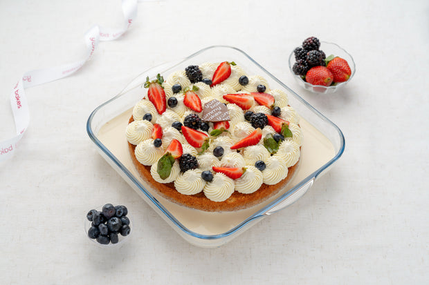 Yummy Bakes Classic Milk Cake topped with fresh berries
