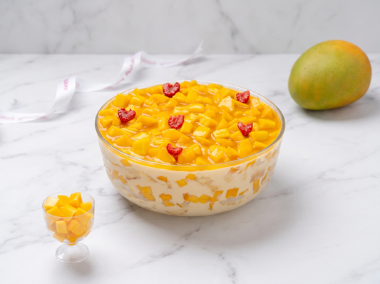 Mango Brulee Trifle by Yummy Bakes Dubai, diced mango and glaze in a glass bowl on white marble