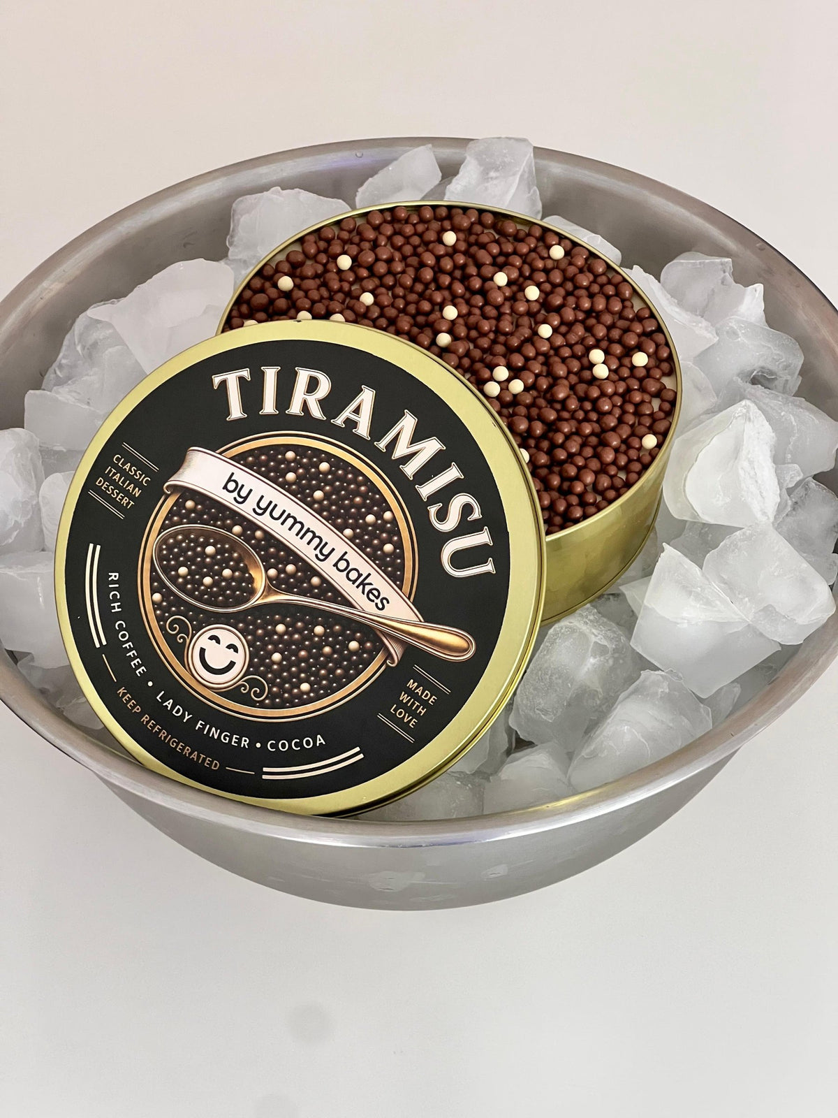 Chocolate crunchy caviar tiramisu in a caviar tin