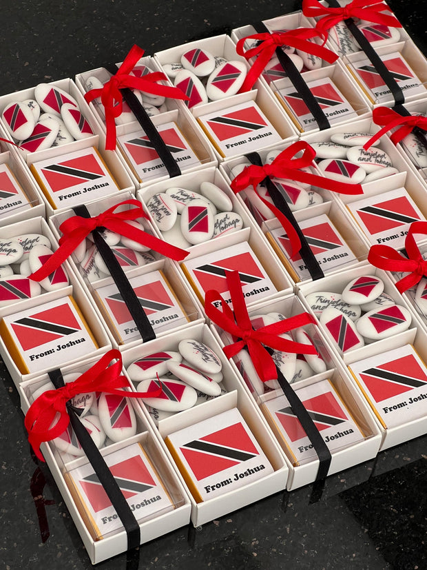 Chocolate and dragee favour boxes with red ribbons