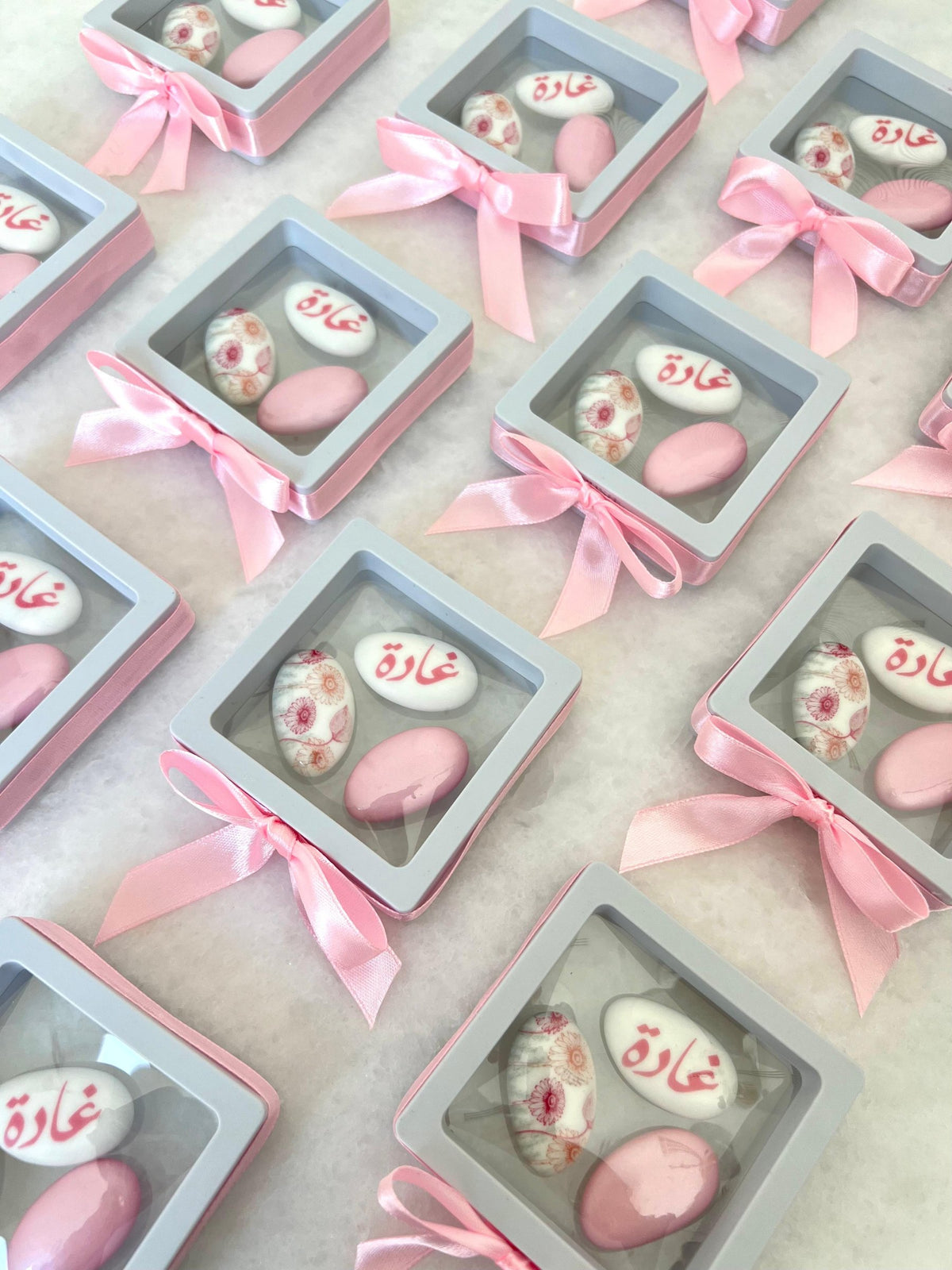 3 dragee plastic favours with pink ribbons, custom printed
